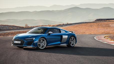 Sleek Audi R8 on Scenic Roadway wallpaper