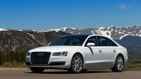Sleek Audi A8 Against Majestic Mountains wallpaper
