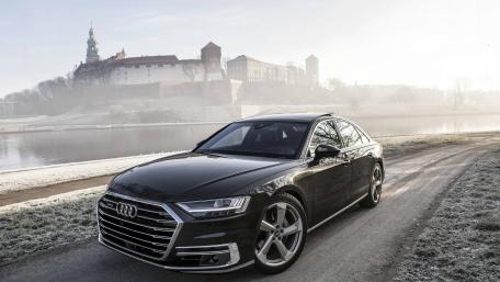 Sleek Audi A8 in a Misty Landscape wallpaper