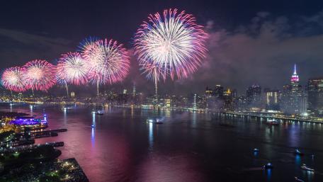 Spectacular Fireworks Over a Vibrant Cityscape wallpaper