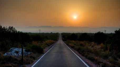 Serene Sunset on a Country Road wallpaper