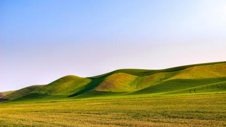 Serene Green Hills in Tranquil Landscape wallpaper