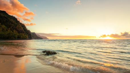 Serene Morning Sunrise over a Tranquil Beach Scene wallpaper