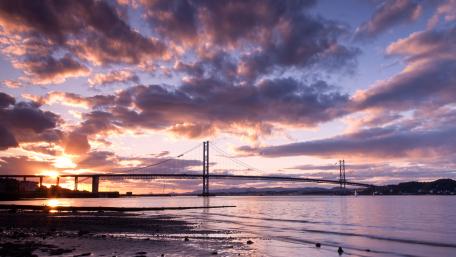 Stunning Sunset Over Bridge in 4K Resolution wallpaper