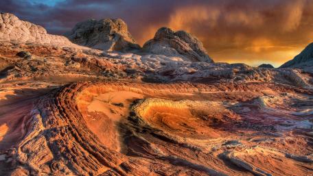 Majestic Badlands Under Cloudy Skies wallpaper