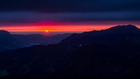 Sunset Tranquility Over Mountain Silhouettes wallpaper