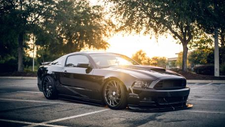 Sleek Black Ford Mustang at Sunset wallpaper