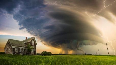 Stormy Serenity Over a Rural Cottage wallpaper