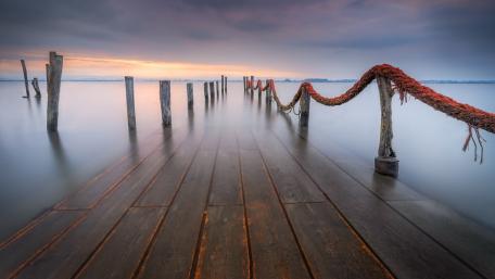 Misty Pier at Dawn Creating Tranquility wallpaper
