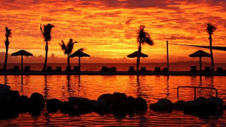 Fiery Sunset Paradise Over Water wallpaper