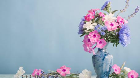 Vibrant Floral Arrangement in Blue Vase wallpaper