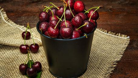 Fresh and Juicy Cherries in a Bucket wallpaper