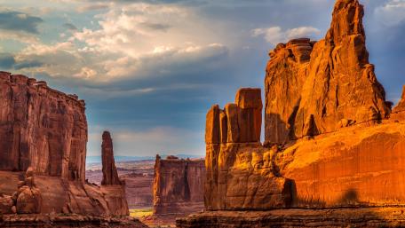 Majestic Desert Landscape with Dramatic Sky Effects wallpaper