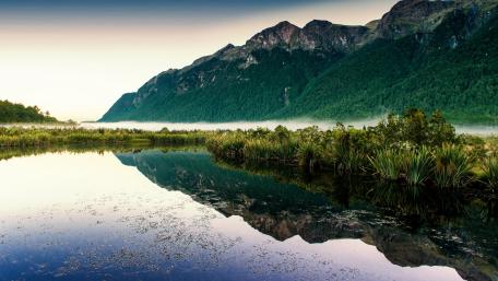 Serene Mountain Reflection in Tranquil Waters wallpaper