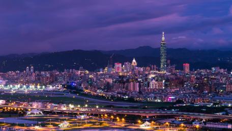Vibrant Nightscape of a Bustling City Skyline wallpaper