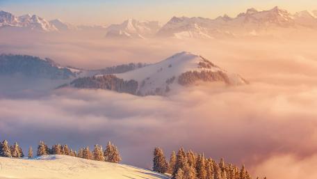 Majestic Mountain Sunrise Above the Clouds wallpaper