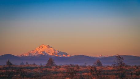 Majestic Mountain Sunrise Over Serene Landscape wallpaper
