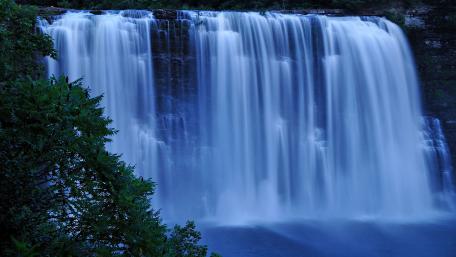 Serene Waterfall Capturing Nature's Beauty wallpaper