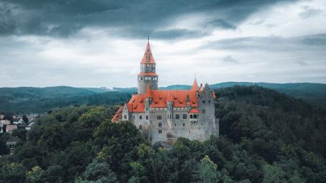 Majestic Castle on a Hill Amidst Dramatic Skies wallpaper