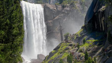Majestic Waterfall Cascading Down Rocks wallpaper