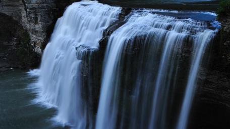 Majestic Waterfall Cascading Down Rocks wallpaper