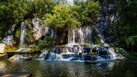 Tranquil Cascade in Nature's Embrace wallpaper