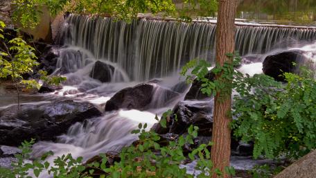 Serene Flow of Nature's Waterfall wallpaper