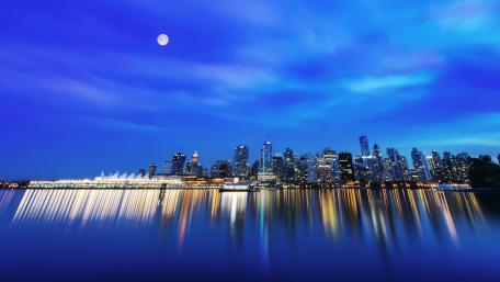 Tranquil City Skyline Under the Full Moon wallpaper