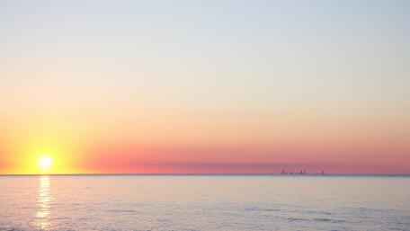 Serene Sunrise Over Calm Waters wallpaper