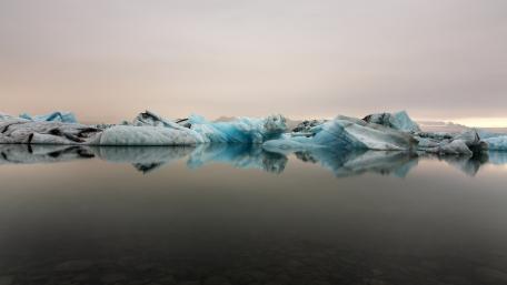 Serene Ice Reflections in Nature's Beauty wallpaper