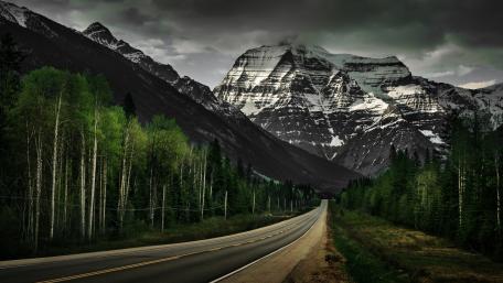 Majestic Mountain Road Through Wilderness wallpaper
