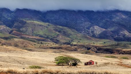 Red cottage at the foot of the mountains wallpaper