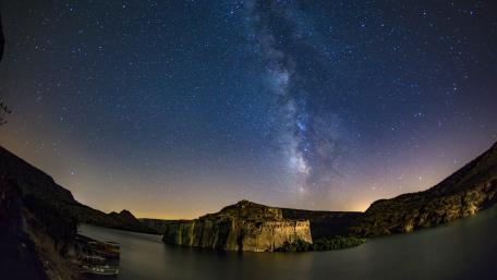 Majestic Milky Way Over Tranquil River Scene wallpaper