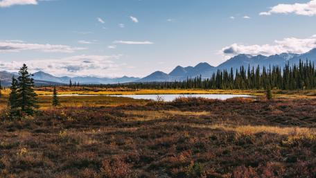 Serene Autumn Landscape with Majestic Mountains wallpaper
