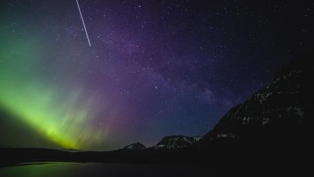 Vibrant Night Sky with Auroras and Stars wallpaper