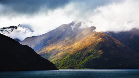 Majestic Mountain Landscape with Serene Waters wallpaper