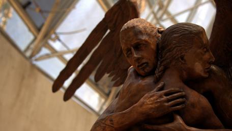 Ethereal Embrace in Urban Sculpture Art wallpaper