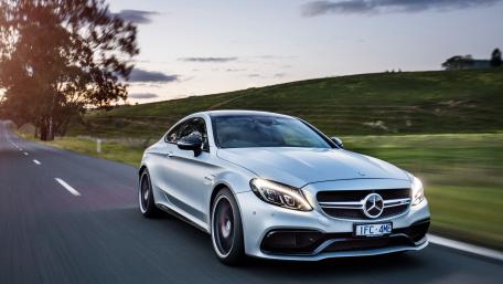 Sleek Mercedes Driving into the Sunset wallpaper