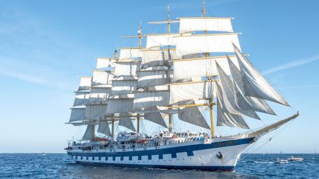 Majestic Sailing Ship Under Clear Skies wallpaper