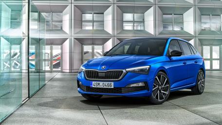 Sleek Blue Skoda in Modern Architecture wallpaper