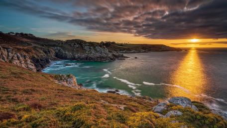 Golden Sunset Over Serene Coastal Bay Scene wallpaper