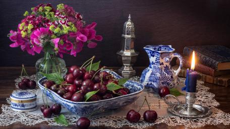 Elegant Cherry Still Life with Candlelight Glow wallpaper