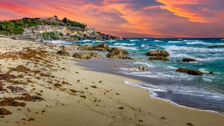 Vibrant Sunset Over Serene Beach Scene wallpaper