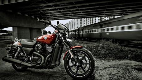 Bold Motorcycle in Urban Landscape Artistry wallpaper