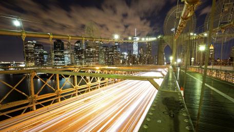 Illuminated Cityscape at Night with Busy Streets wallpaper