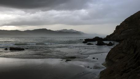 Serene Coastal Landscape with Dramatic Skies wallpaper
