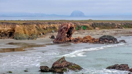Serene Coastal Landscape with Rock Formations wallpaper