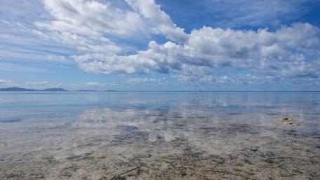 Serene Reflections of Sky and Water in Nature wallpaper