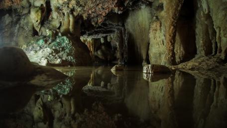Mystical Cave with Reflective Waters wallpaper