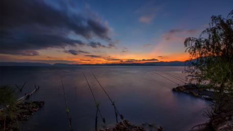 Peaceful Sunset Fishing Scene at the Lake wallpaper